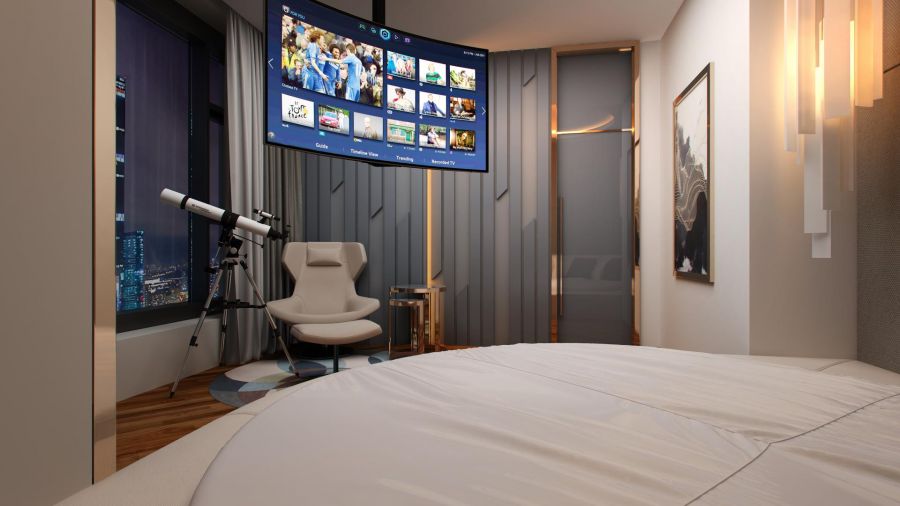 Подвесной телевизор над кроватью в спальне