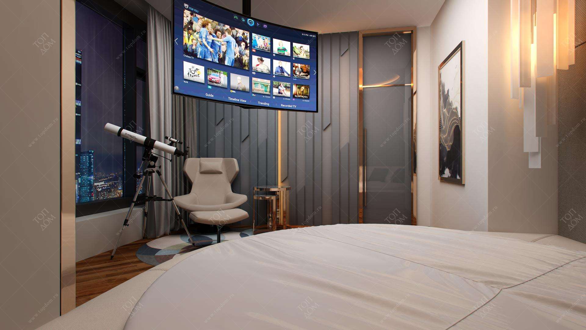 Телевизор в спальне перед кроватью